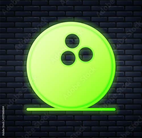 Glowing neon Bowling ball icon isolated on brick wall background. Sport equipment. Vector