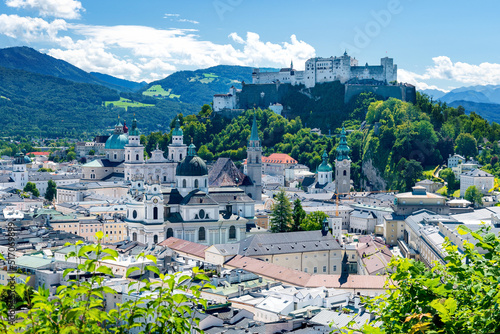 World heritage of the old town of Salzburg in Austria with medieval Hohensalzburg fortress and Salzkammergut mountains