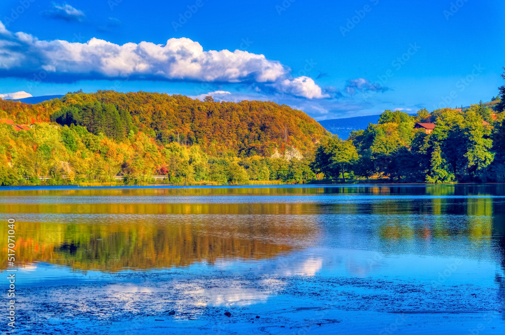 Landscape view over great Pliva lake during autumn day in Jajce, Bosnia and Herzegovina.