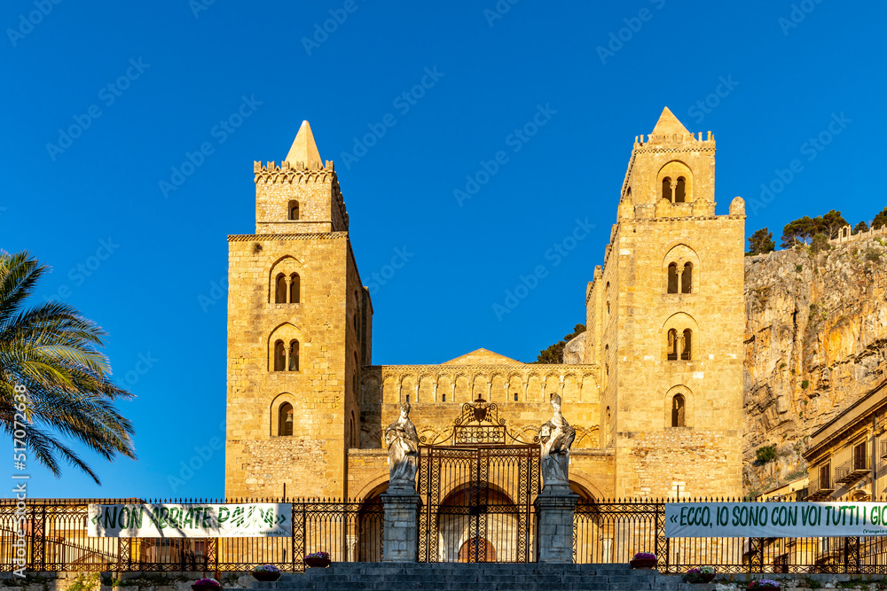 Cefalu, Sicily - Italy - July 7, 2020: View of Cefalu Cathedral or Duomo di Cefalu and Piazza del Duomo in the coastal town of Cefalu in Sicily in Italy
