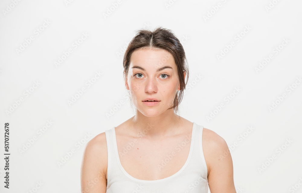 Close-up portrait of a beautiful young woman dressed in a white t-shirt isolated on white.'portrait of a young Ukrainian girl with different emotions Close-up portrait of a beautiful young woman dressed in a white t-shirt isolated on white.'portrait of a young Ukrainian girl with different emotions