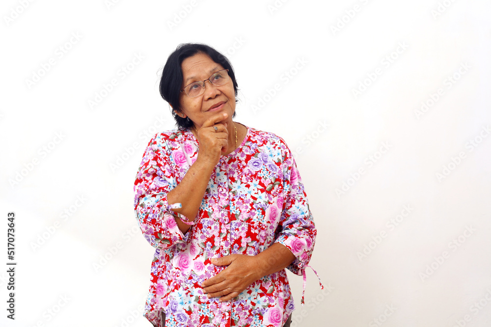 Happy asian elderly woman standing while thinking and looking up. Daydream concept. Isolated Happy asian elderly woman standing while thinking and looking up. Daydream concept. Isolated