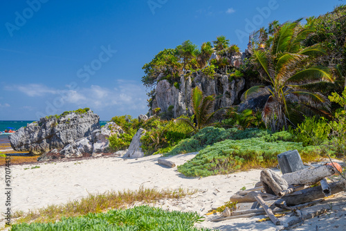 Fotografering White sand beach with palms, temple of the descending god, Mayan Ruins in Tulum,