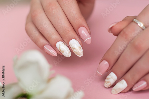  Beautiful female hands with luxury manicure nails  pink and white gel polish
