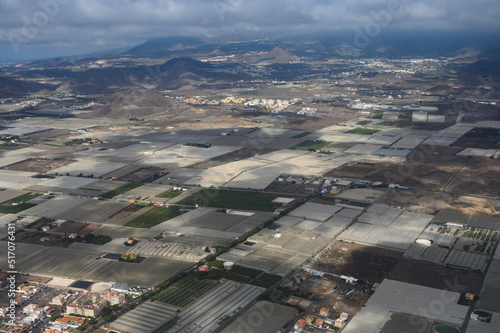 Aerial panoramic view on south part of Tenerife island, agricultural and volcatic landscape, Canary islands, Spain photo