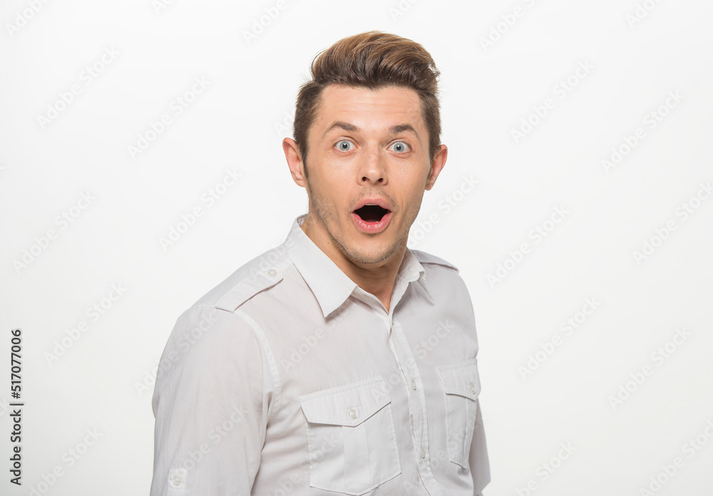 close-up portrait of a man in a white shirt on a white background isolated.portrait of a man with different emotions isolated. close-up portrait of a man in a white shirt on a white background isolated.portrait of a man with different emotions isolated.