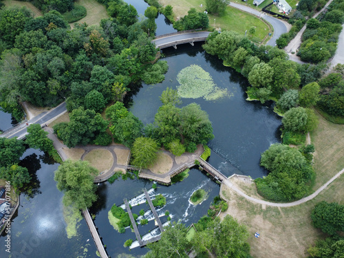 Aerial view of weir and bridge on a river in Hoddesdon with clear tranquil water