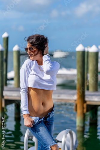 A Lovely Brunette Female Model Enjoys The Summer Weather On The Shores Off Key West photo