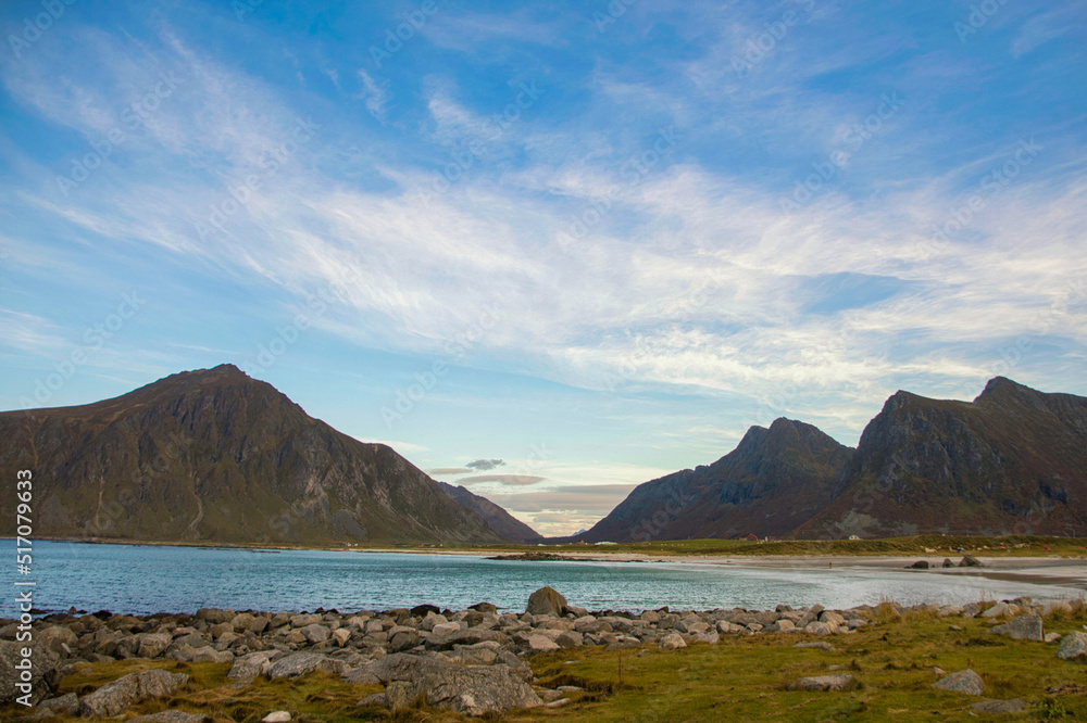 Spectacular autumn scenery in the Lofoten Islands, in the Arctic Circle of Norway. Mountainous islands meet the sea.