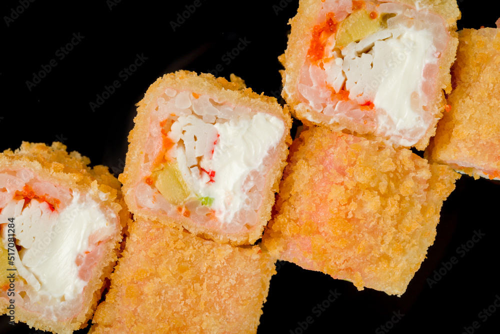 Hot kaisen roll with crab and spicy sause. chinese cuisine on black with reflection Hot kaisen roll with crab and spicy sause. chinese cuisine on black with reflection