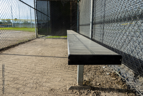 фотографія Angled view of the dugout on a baseball field, without any people around