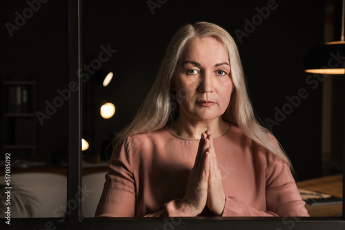 Religious mature woman pray...