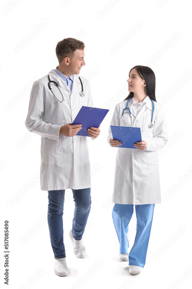 Medical assistants with clipboards on white background Medical assistants with clipboards on white background