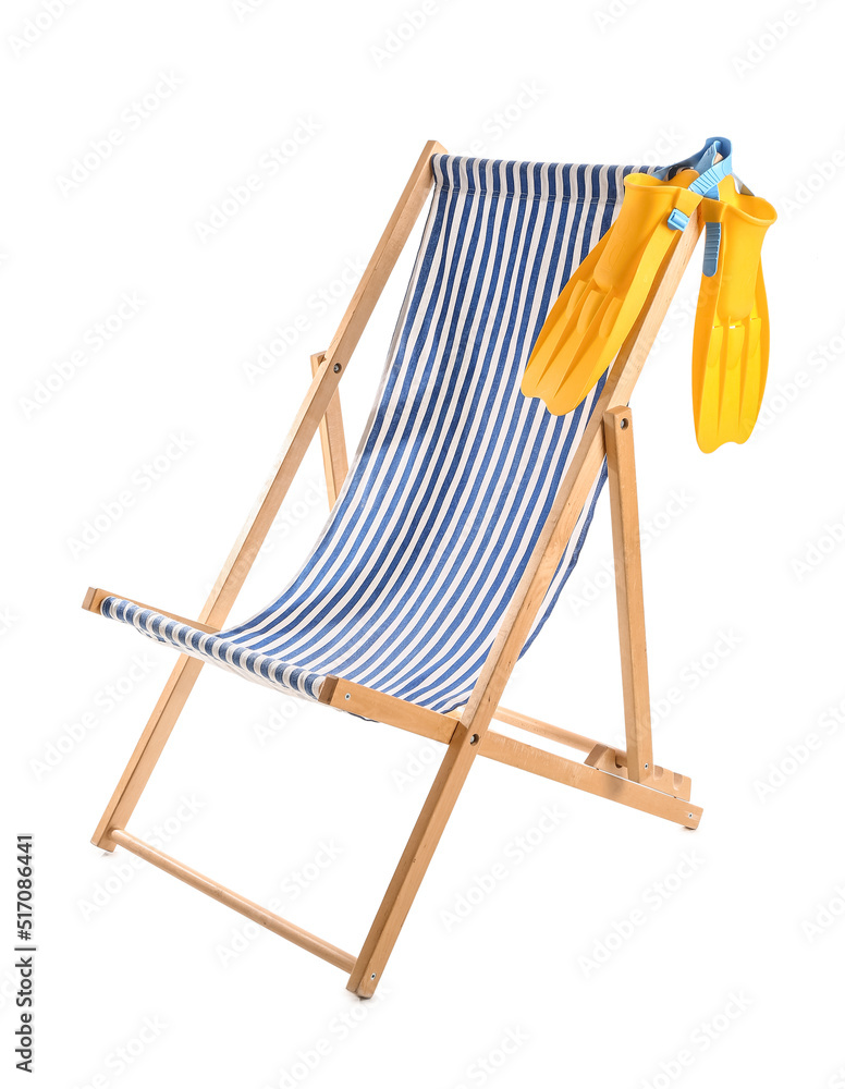 Striped deck chair with paddles on white background