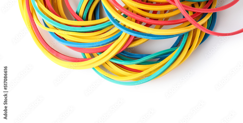 Many colorful rubber bands on white background, closeup