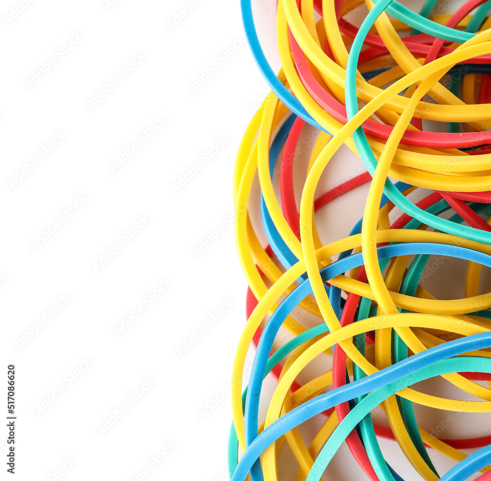 Many colorful rubber bands on white background, closeup Many colorful rubber bands on white background, closeup