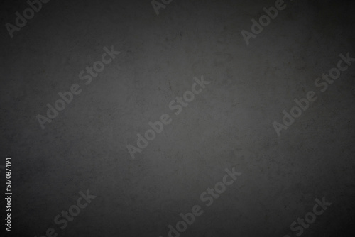 Dark grey vignette concrete background texture.