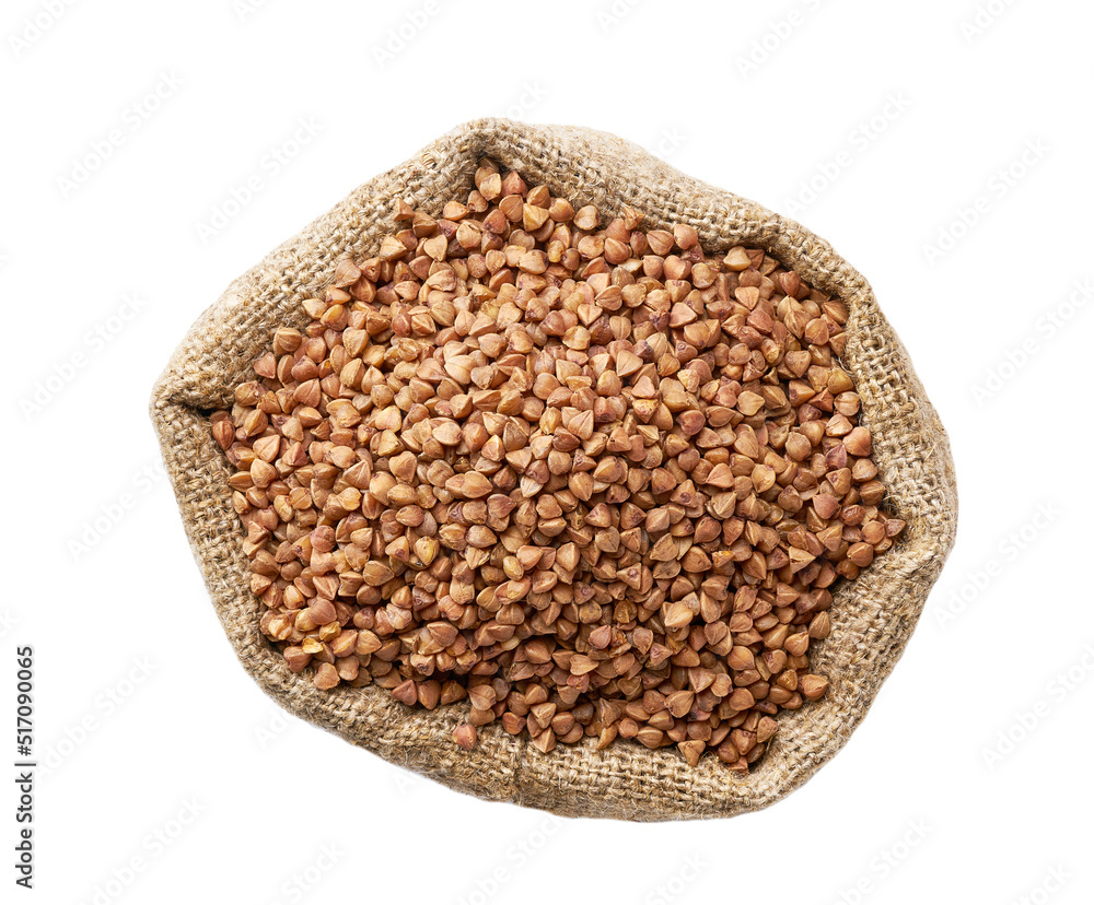 Raw organic buckwheat in sack isolated on white background top view. Raw organic buckwheat in sack isolated on white background top view.
