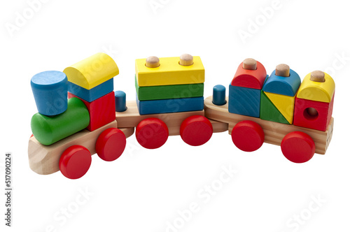 Vintage toy train model made of blocks in many shapes isolated on white background with a clipping path cutout concept for childhood development, minimalist nostalgic toys and educational play time photo