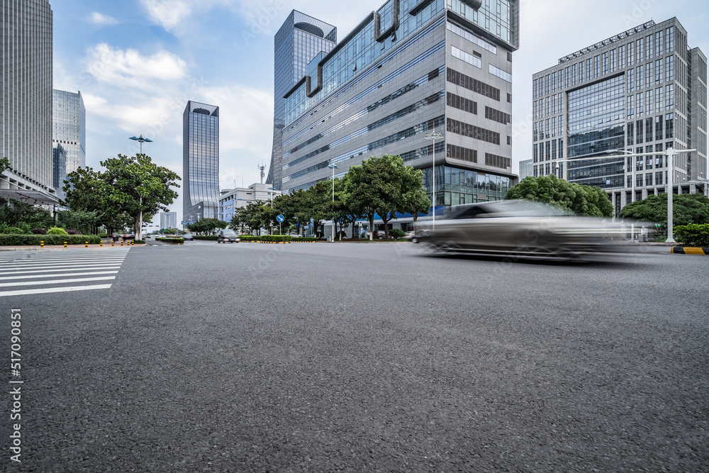 empty asphalt road with city skyline background in china empty asphalt road with city skyline background in china