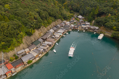 Tour Boat Leaves Port at Funaya Fisherman Houses in Ine-cho Town, Japan photo