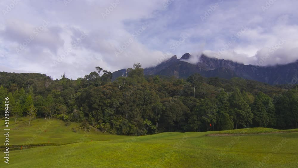 4K Timelapse of Mount Kinabalu with Dramatic cloud movement. Pan right effect 4K Timelapse of Mount Kinabalu with Dramatic cloud movement. Pan right effect
