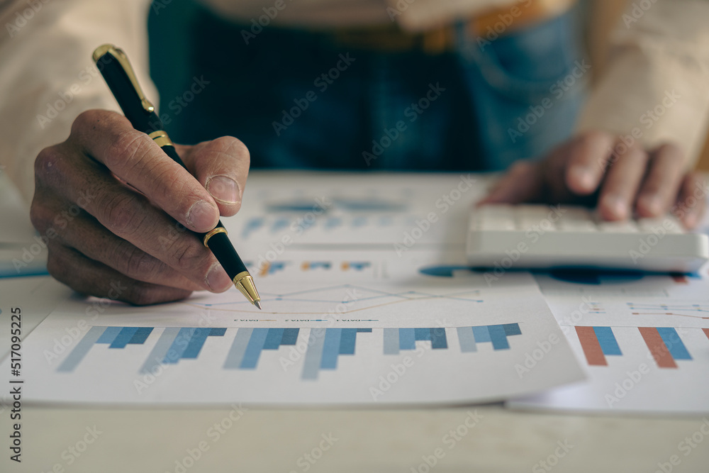 The company's accountant analyzes the expenses on the business desk. financial reporting accountant computer with graph chart business idea Finance and Accounting The company's accountant analyzes the expenses on the business desk. financial reporting accountant computer with graph chart business idea Finance and Accounting