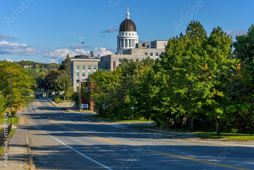 Capitol Street - A sunny Autumn sunday afternoon view of quiet Capitol Street at Downtown Augusta, with the dome of Maine Capitol Building towering in background. Augusta, Maine, USA. photo