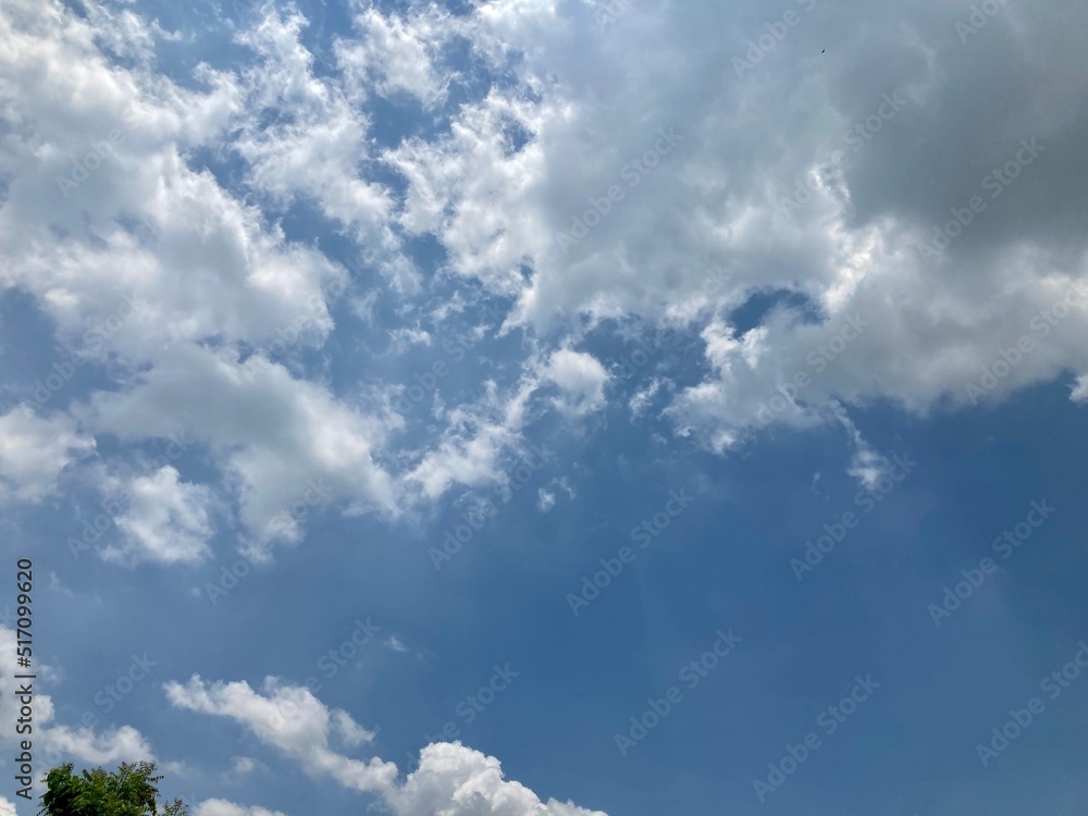 White clouds in the blue sky.Winter cold clouds blue heaven background. White clouds in the blue sky.Winter cold clouds blue heaven background.