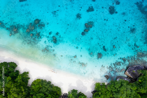 Fototapeta Naklejka Na Ścianę i Meble -  Sunny aerial view and aerial photographs of the beautiful tropical paradise beach of the Andaman Sea. amazing view Beach, turquoise water and coral amazing under the sea.
