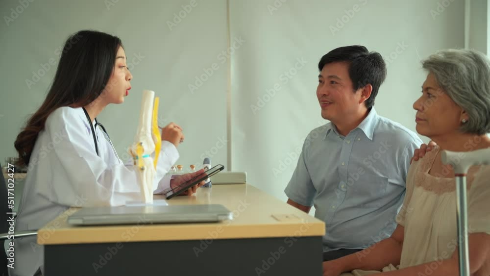 Specialist female doctor is introducing a treatment program to patients to maintain the health of the old woman back to being strong as before. The son of a female patient encourages his mother. Specialist female doctor is introducing a treatment program to patients to maintain the health of the old woman back to being strong as before. The son of a female patient encourages his mother.