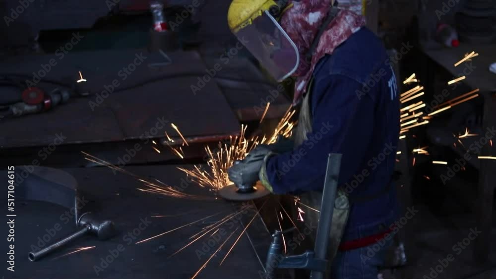 Worker polishing in metal industry Worker polishing in metal industry