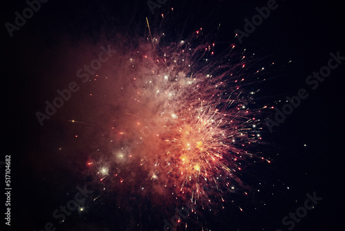 multicolored lights of fireworks exploding in the night sky