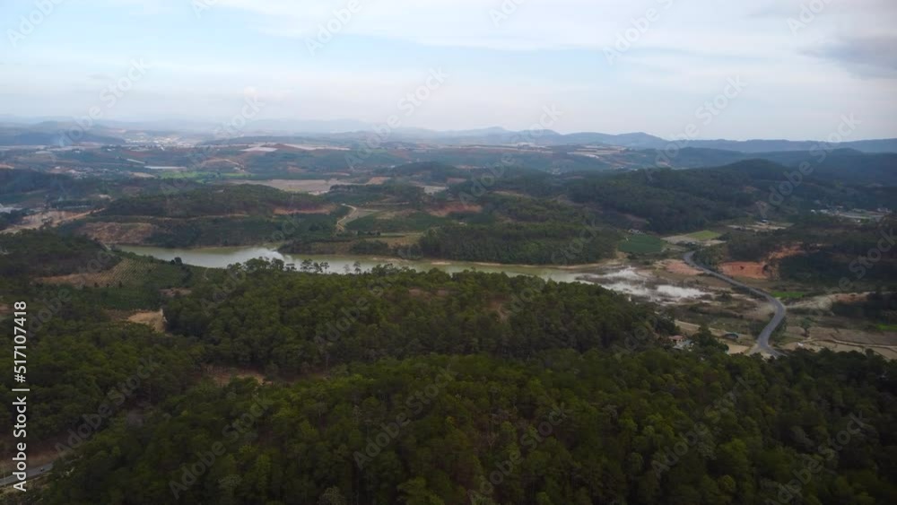 Aerial drone view of Ta Nang coffee fields on both sides of a large river in Vietnam Aerial drone view of Ta Nang coffee fields on both sides of a large river in Vietnam