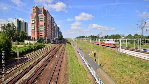 A view of the office buildings and railroad tracks from the footbridge over railway station.