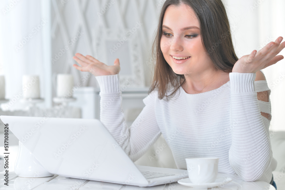 Beautiful woman work with laptop and drink coffee Beautiful woman work with laptop and drink coffee