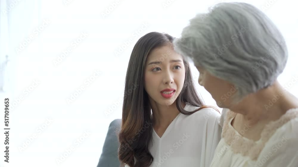 Asian daughter and mother talking and embracing together. Asian daughter and mother talking and embracing together.