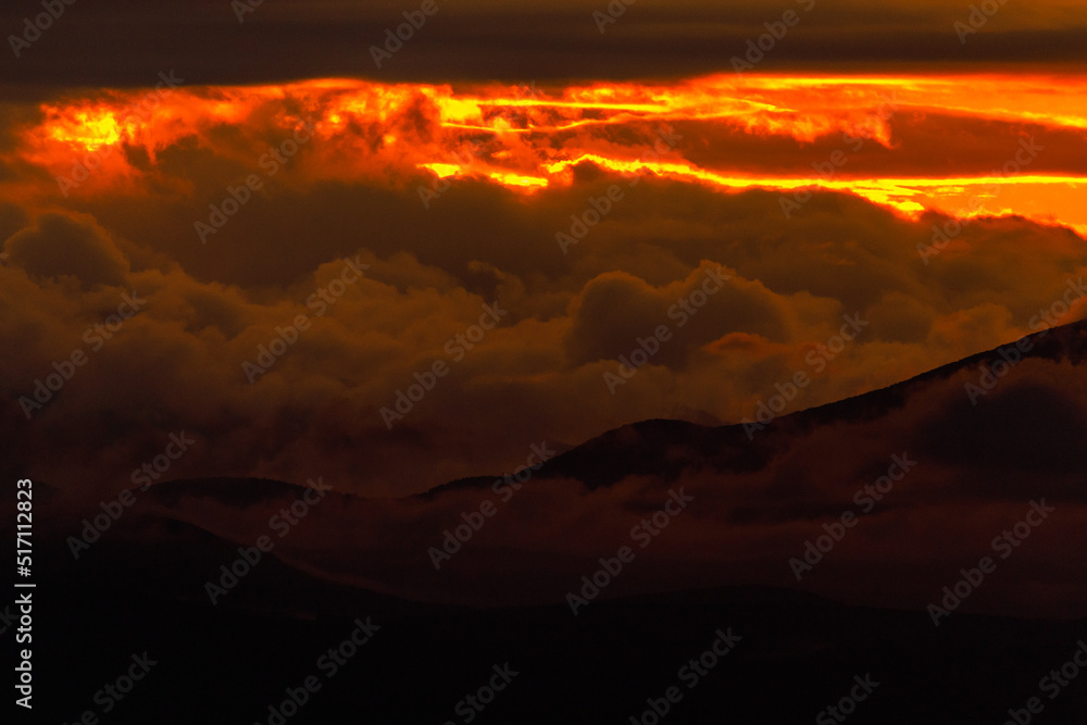 Bright dawn in the sea. Beautiful scarlet and red clouds during a colorful sunrise in Vladivostok. Bright dawn in the sea. Beautiful scarlet and red clouds during a colorful sunrise in Vladivostok.