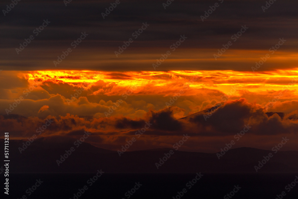 Bright dawn in the sea. Beautiful scarlet and red clouds during a colorful sunrise in Vladivostok. Bright dawn in the sea. Beautiful scarlet and red clouds during a colorful sunrise in Vladivostok.
