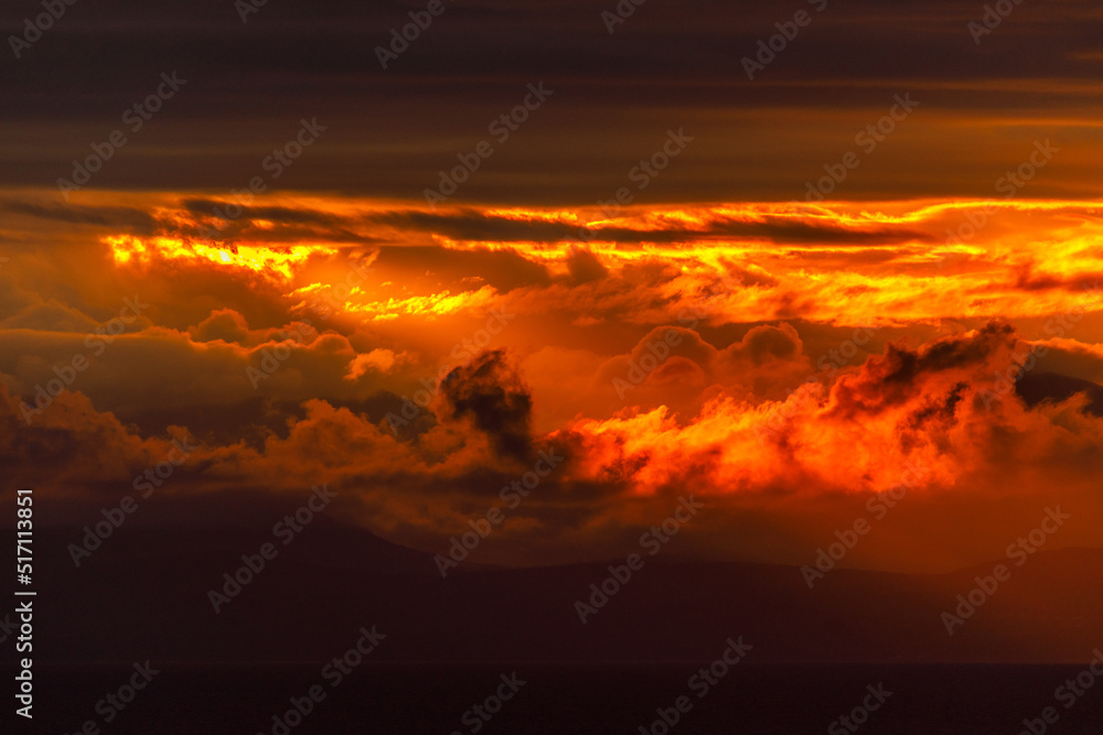 Bright dawn in the sea. Beautiful scarlet and red clouds during a colorful sunrise in Vladivostok. Bright dawn in the sea. Beautiful scarlet and red clouds during a colorful sunrise in Vladivostok.