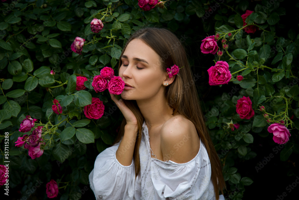 beautiful brunette girl in the garden with pink roses flowers beautiful brunette girl in the garden with pink roses flowers