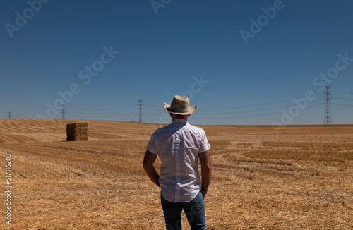 Adult man in cowboy hat in fields. Castilla y Leon, Spain © WeeKwong