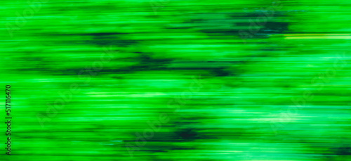 Abstract Green trees motion blurred green leaves background.Banner.