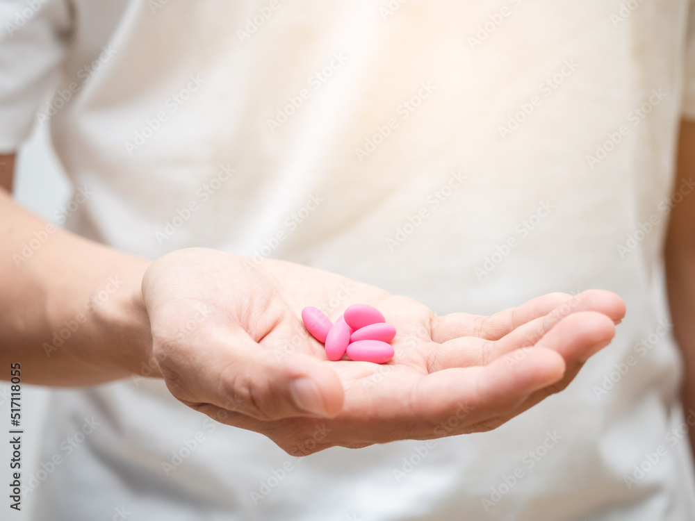 Close-up medicine pills in man hand Close-up medicine pills in man hand