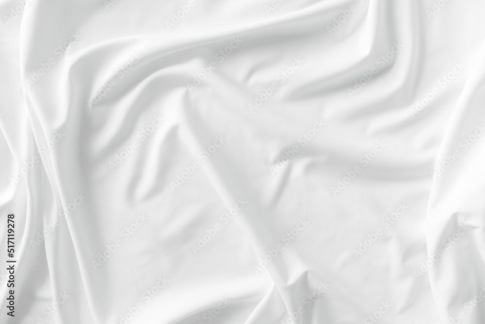 White fabric. luxurious white fabric texture background. Creases of satin, silk, and cotton.