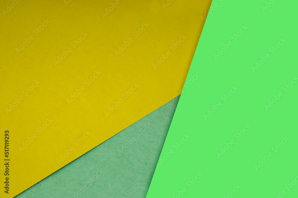 Dark and light, Plain and Textured Shades of yellow neon green papers background lines intersecting to form a triangle shape Dark and light, Plain and Textured Shades of yellow neon green papers background lines intersecting to form a triangle shape