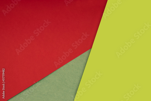 Dark and light  Plain and Textured Shades of red yellow green papers background lines intersecting to form a triangle shape