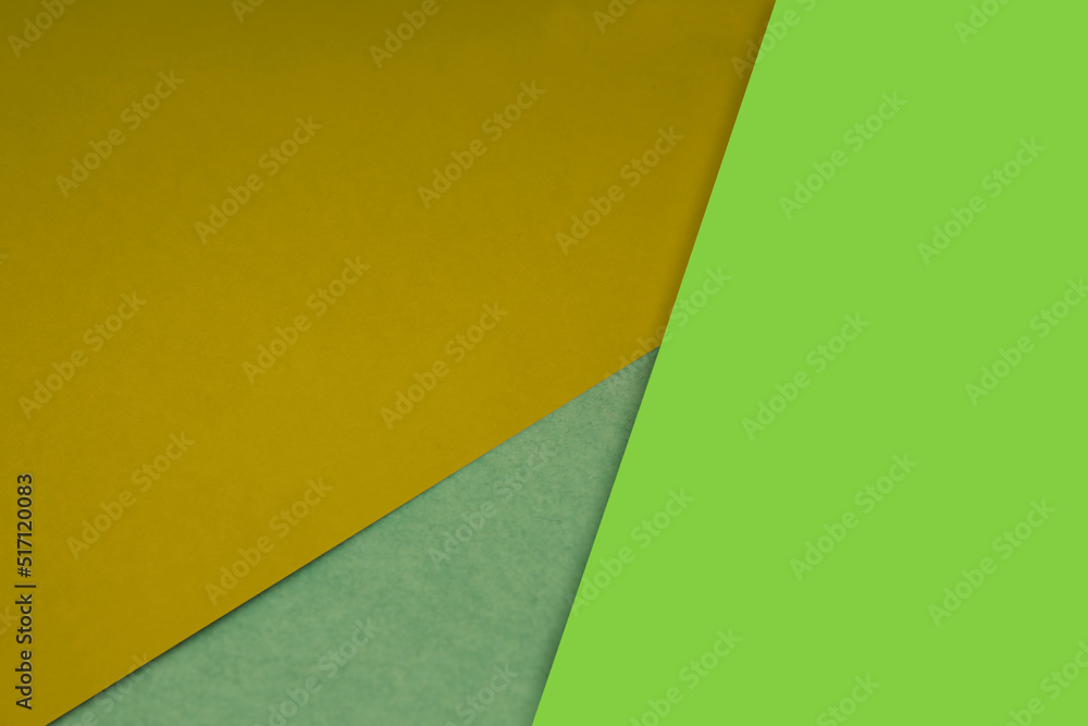 Dark and light, Plain and Textured Shades of yellow neon green papers background lines intersecting to form a triangle shape