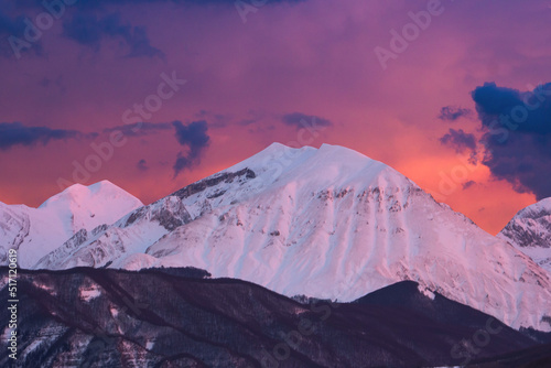 Obraz na plátně View of winter fiery sunset over Monte Corvo in the Gran Sasso e Monti della Lag