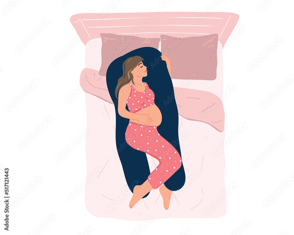 Top view young pregnant woman in pajamas sleeping on a maternity pillow on the bed. Comfortable sleeping position, healthy night sleep. Preparing for childbirth. Health and pregnancy care. Motherhood. Top view young pregnant woman in pajamas sleeping on a maternity pillow on the bed. Comfortable sleeping position, healthy night sleep. Preparing for childbirth. Health and pregnancy care. Motherhood.